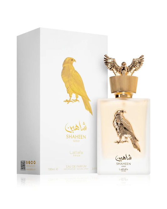 Profumo unisex Shaheen Gold Lattafa Pride. Vista completa con elegante scatola bianca e oro e flacone satinato sormontato dal tappo dorato a forma di falco
