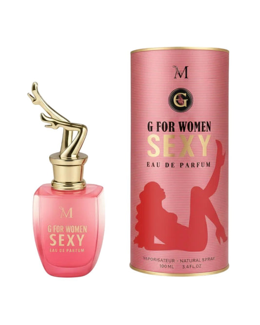 Profumo donna G For Women Sexy di Montage Brands. Flacone rosa in vetro con tappo dorato a forma di gambe femminili, accanto alla confezione cilindrica con silhouette.