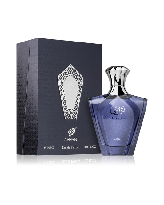 Profumo uomo Turathi Homme Blue di Afnan. Vista completa con elegante scatola blu scuro decorata con motivi argento e flacone sfaccettato